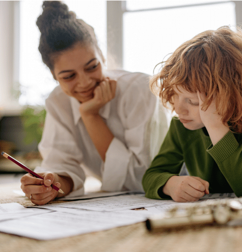 Child completing an activity with a mental health professional during an ADHD assessment